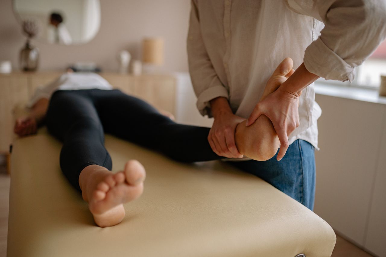 Mastering the First Impression: Your intriguing post title goes here Close-up of a foot massage therapy session, showcasing relaxation and wellness indoors.